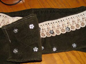 Stud fasteners sewn on