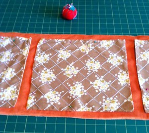 Square pieces sewn on to rectangle