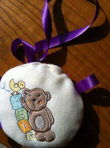 Plush baby toy stuffed with  top edge pinned