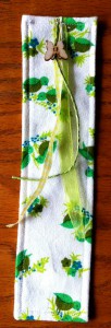 Completed bookmark with gift ribbon sewn on as embellishment