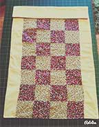 history of patchwork quilting